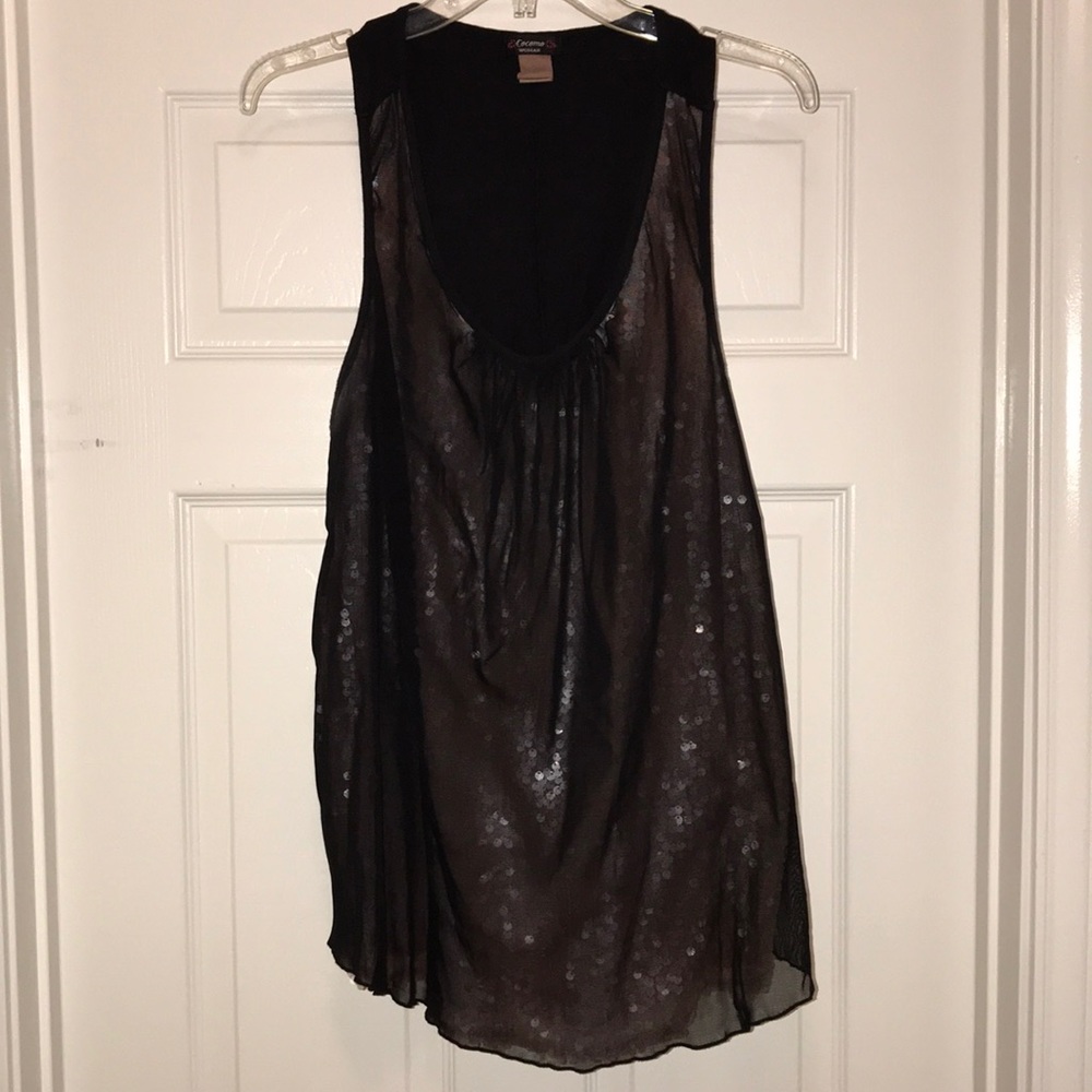Sleeveless black sheer over pink sequins.